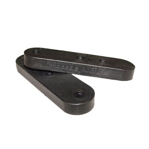 Two black rubber spacers stacked together