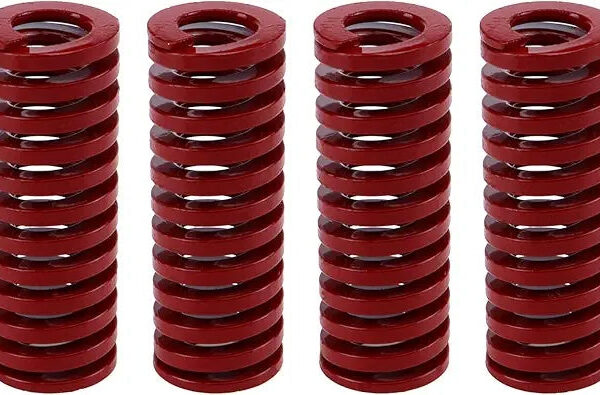 Four red metal coil springs stacked.