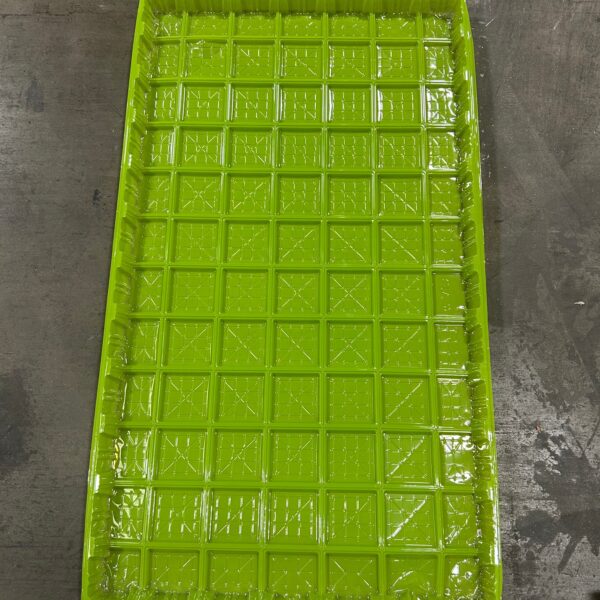 Bright green plastic tray with compartments