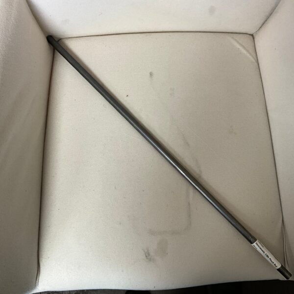 Metal rod on a white surface