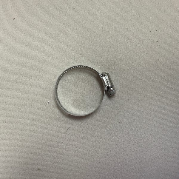 Metal hose clamp on a surface