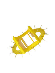 Yellow spiked object, possibly a tool.