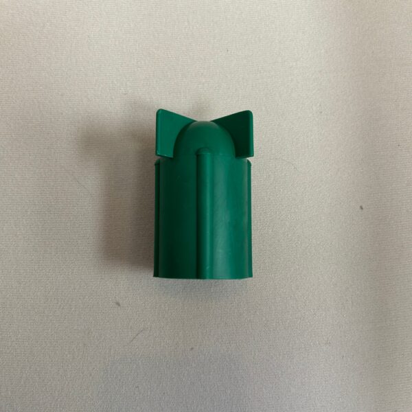 Green plastic object resembling a rocket