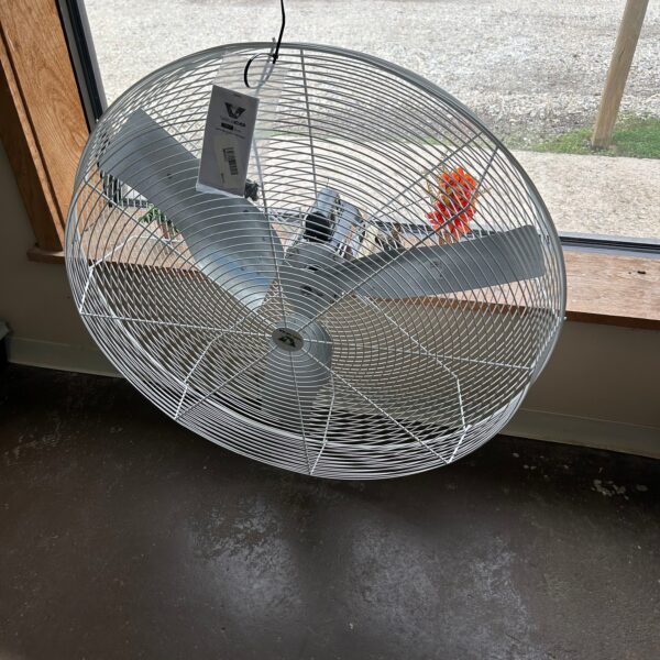 Large white fan near window