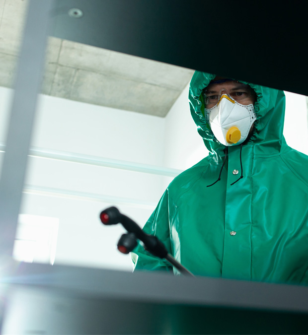 Person in green protective clothing.
